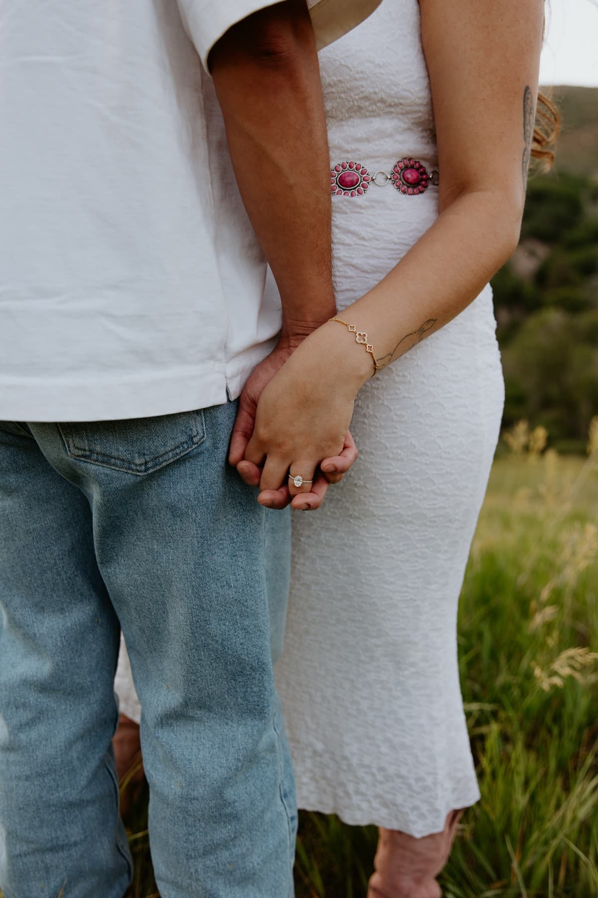 Holding hands in the tall grass