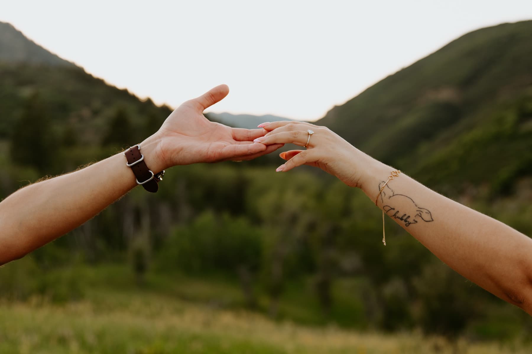 Reaching for each other's hands in the hills